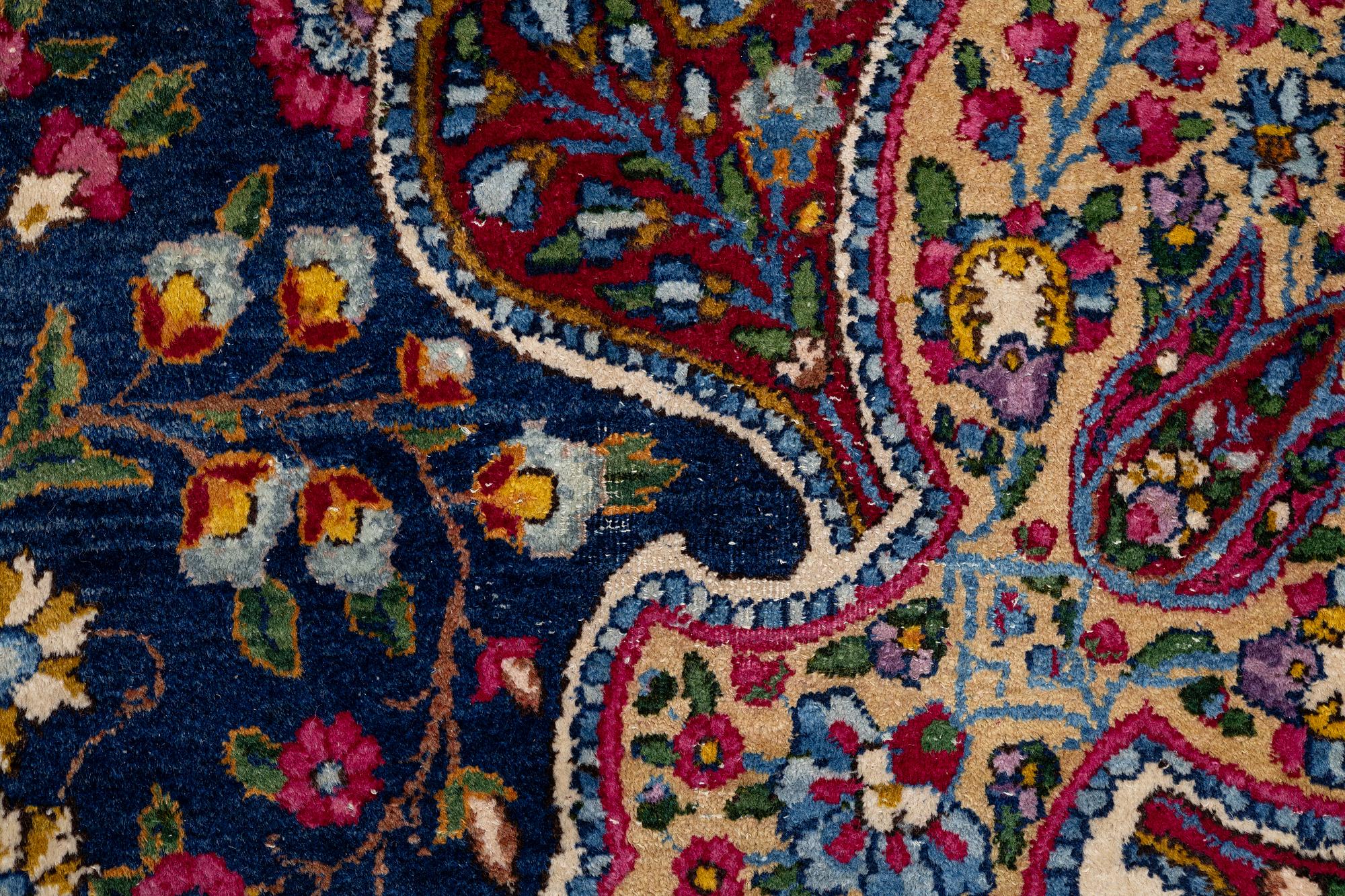 A semi-antique Kirman carpet, south Persia, c. 440 x 279 cm.
