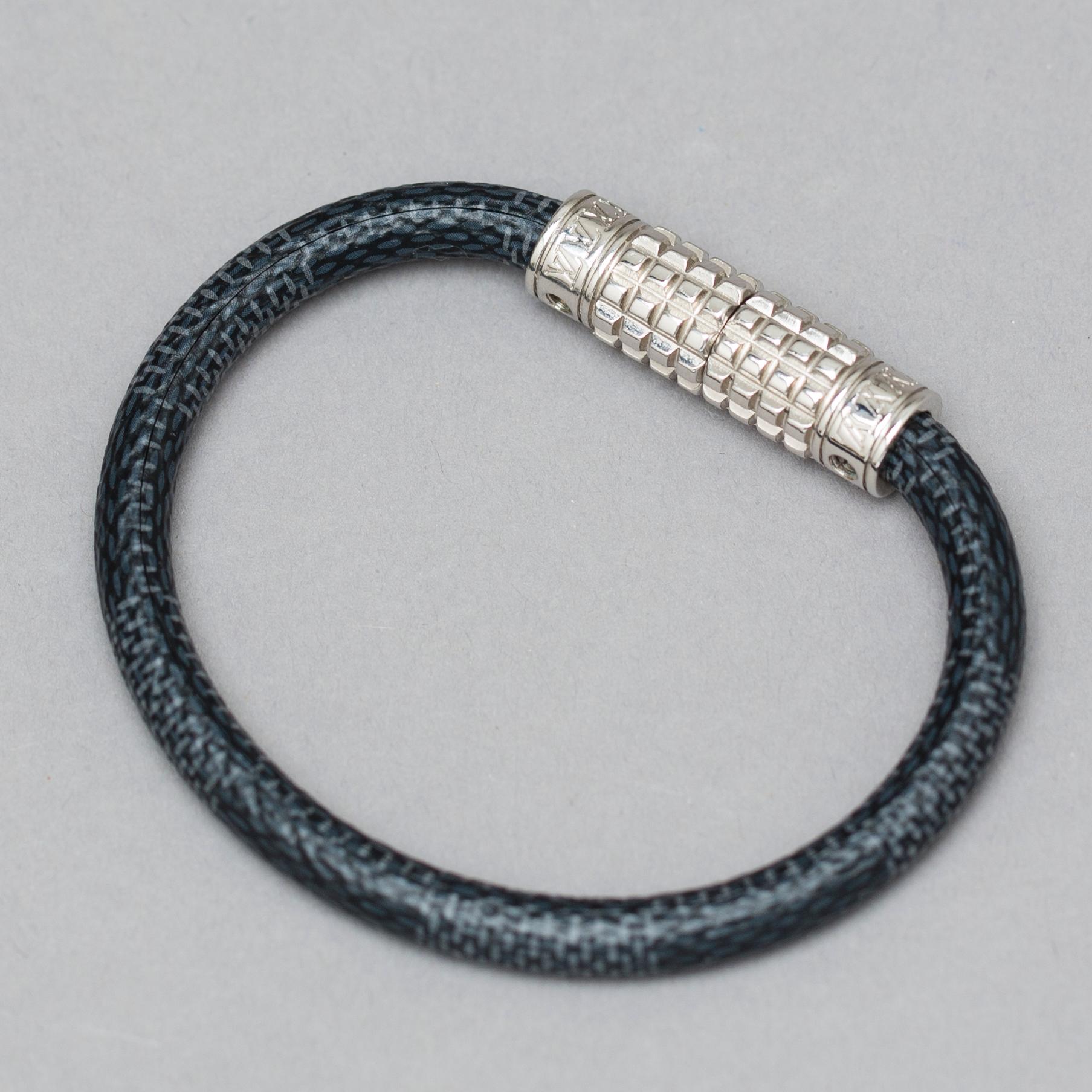 A Louis Vuitton "Digit" bracelet.