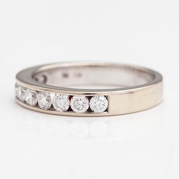 An 18K gold eternity ring with brilliant cut diamonds 1.0 ct in total according to engraving.