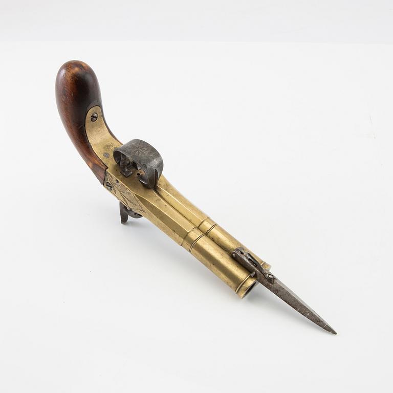Double-barrel percussion pistol with bayonet, 19th century.