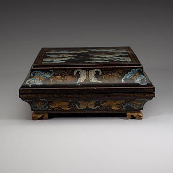 A black lacquer box and cover with a nine-piece cabaret, Qing dynasty, 19th Century.