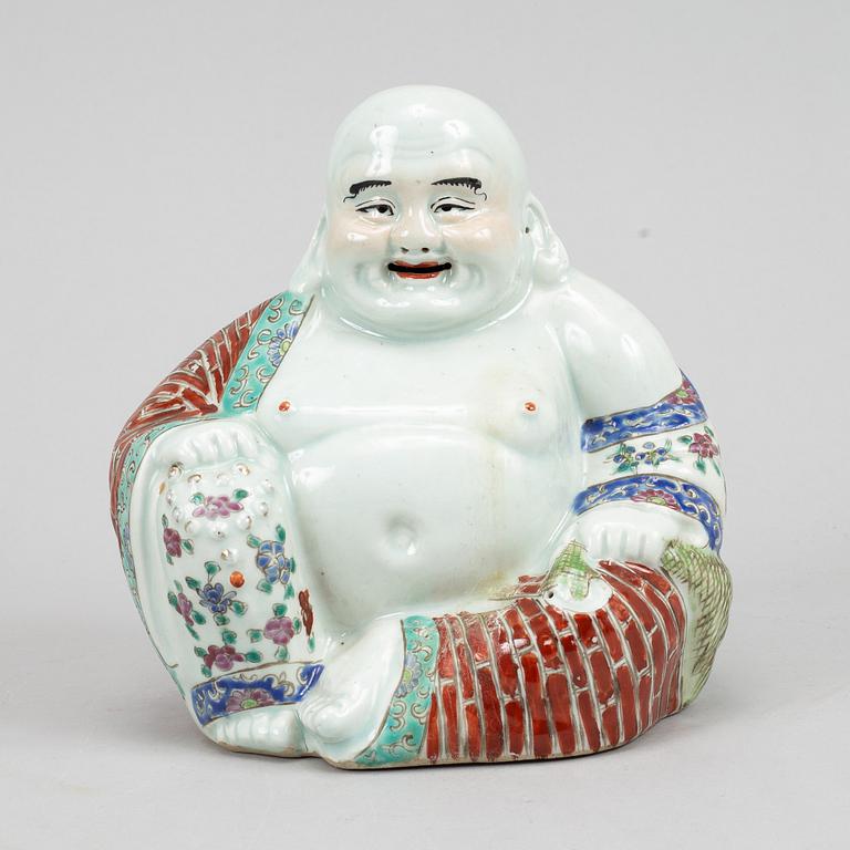 A seated famille rose decorated porcelain buddha, 20th century.