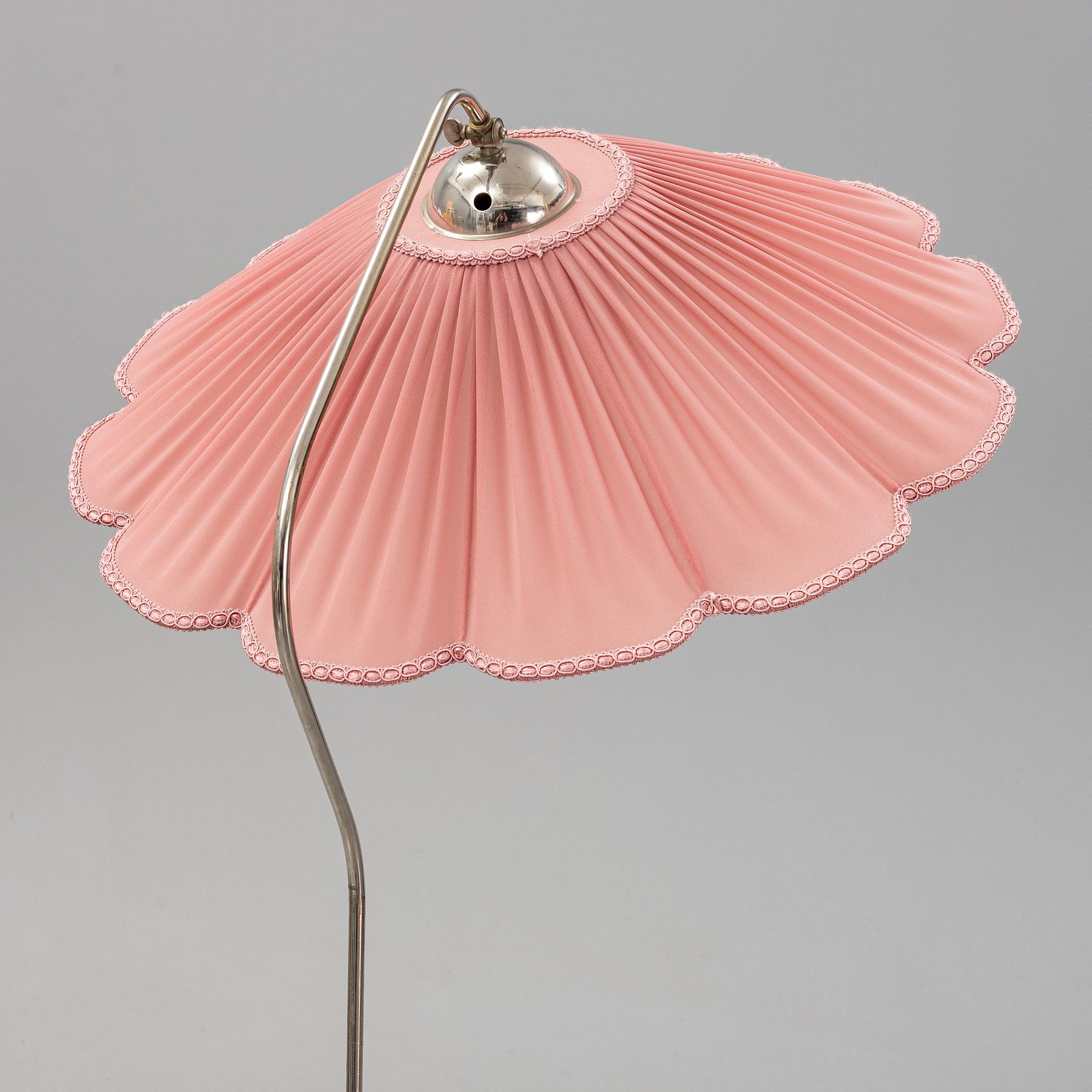 A 1940s birch wood floor lamp.