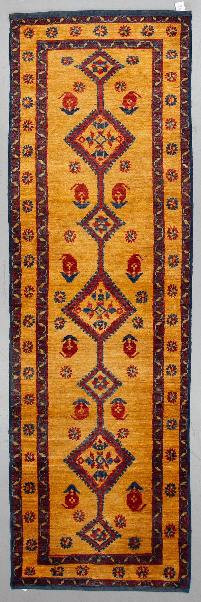 An oriental runner, ca 305 x 94 cm.