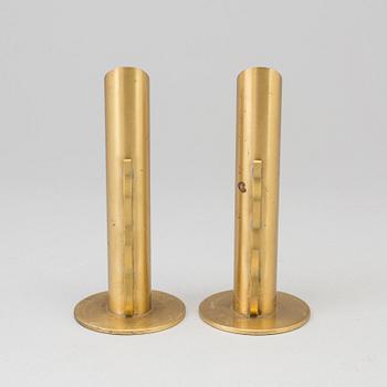 A pair of Swedish brass candlesticks/vases, mid 20th Century.