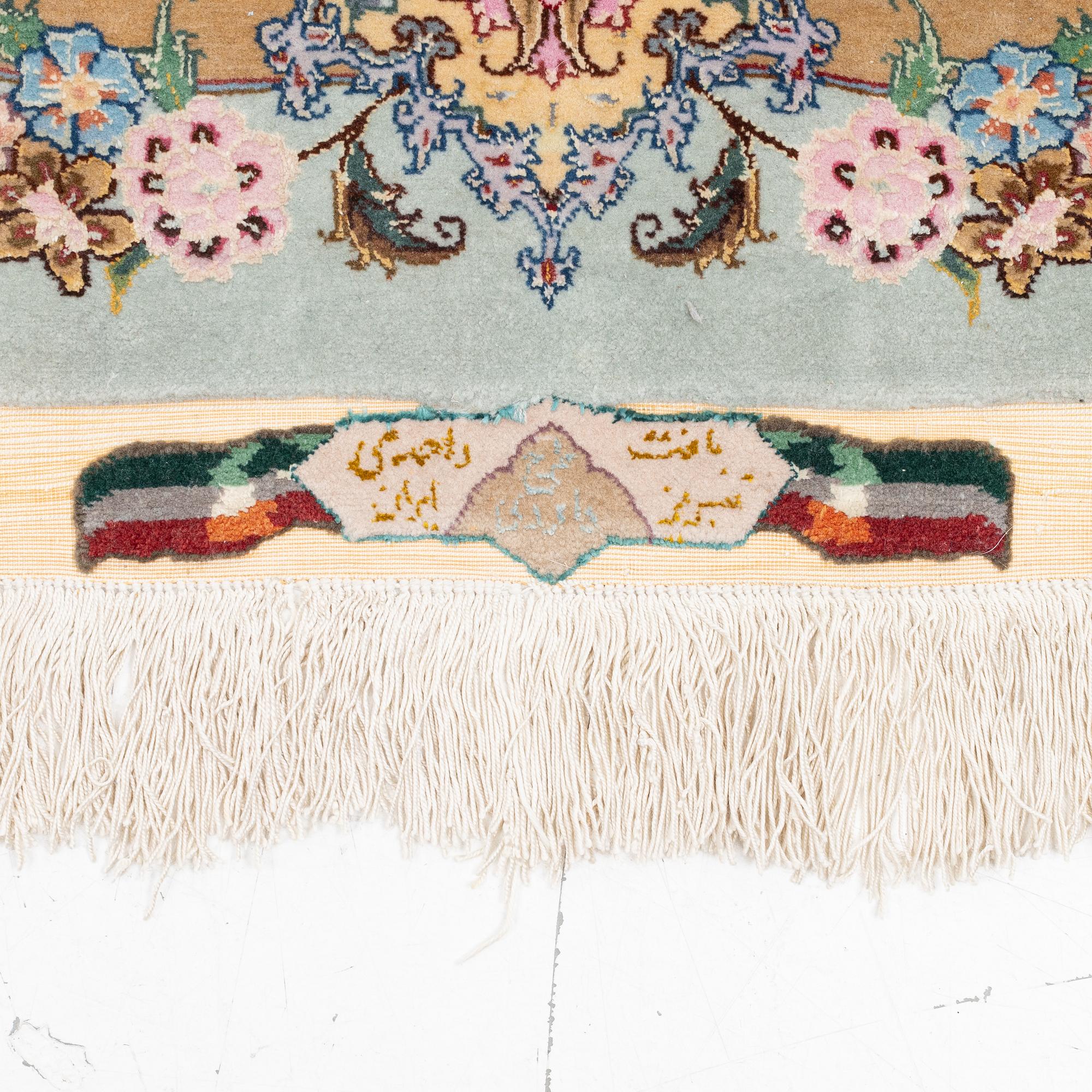 A Tabriz carpet, part silk, approx. 367 x 250 cm.