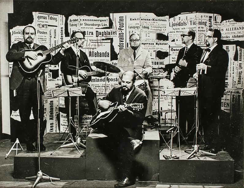 A SIGNED BLACK AND WHITE PHOTOGRAPH DEPICTING SWEDISH COMEDY GROUP "SKÄGGEN" CIRCA 1963.