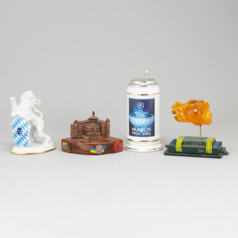 Four sculptures and a jug.