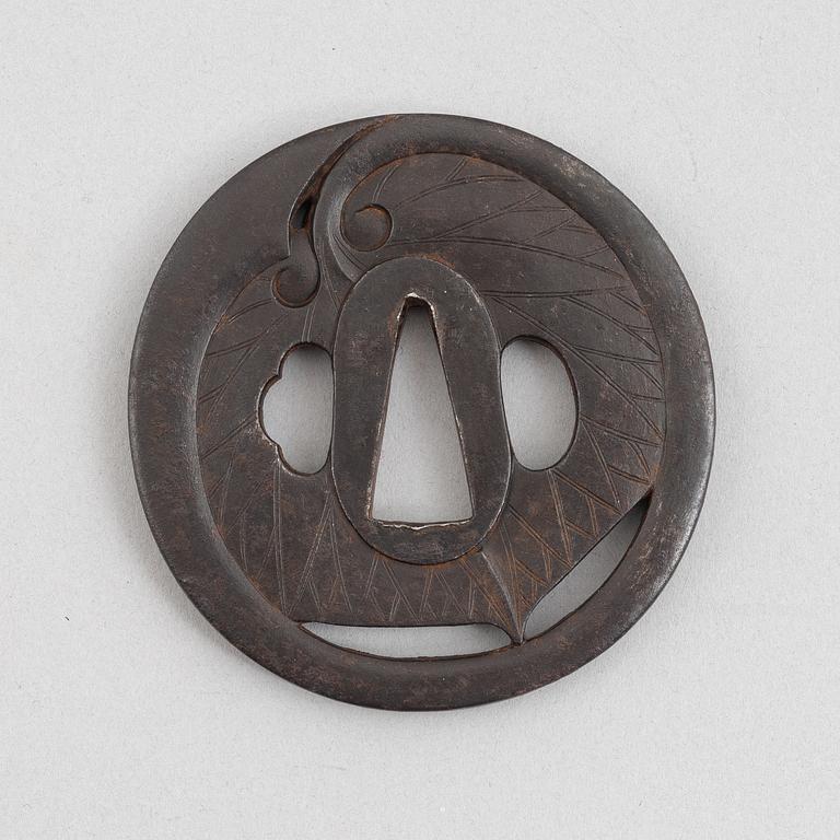 Tsuba, Japan, signed Echizen Ju Kinai, mid-1600s.