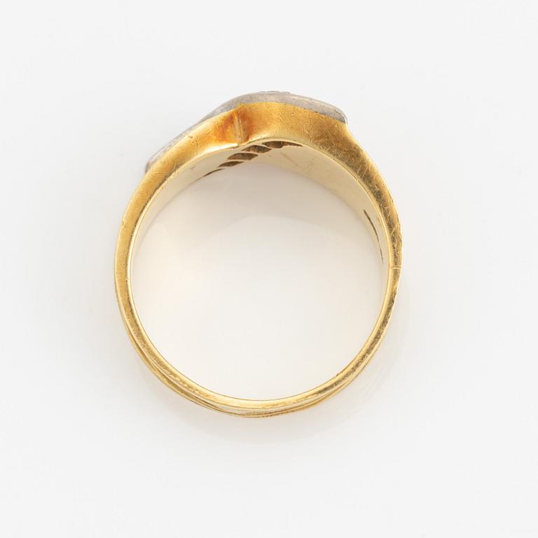 An 18K gold ring set with eight-cut diamonds.