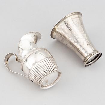 A silver creamer, beaker, and platter, Sweden, 18-19th century.