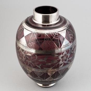 A large glass vase, probably Murano, Italy.