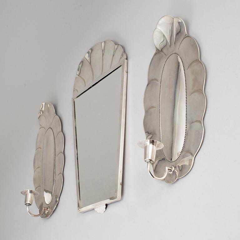 A mirror and a pair of wall lights, silver plate, GAB, early 20th century.