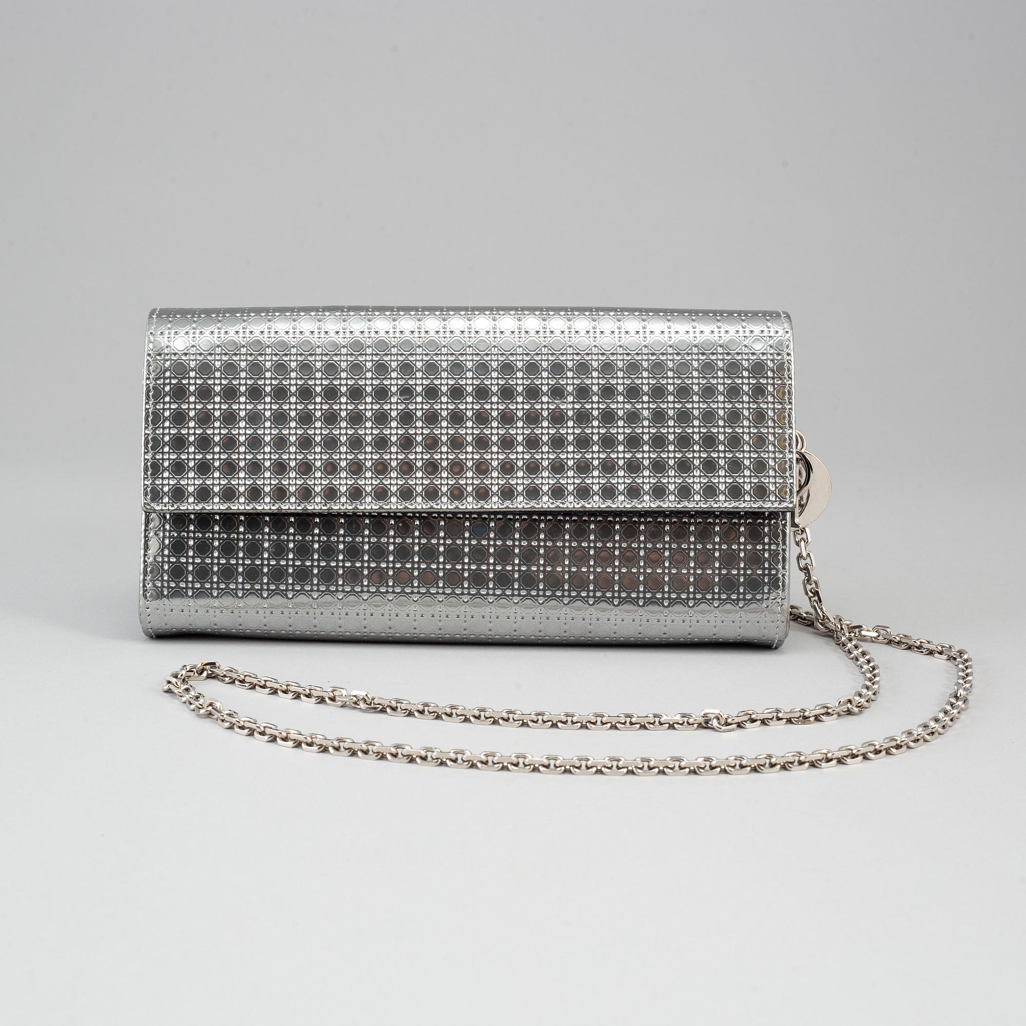 CHRISTIAN DIOR, an embossed metallic leather 'Wallet on Chain' clutch.