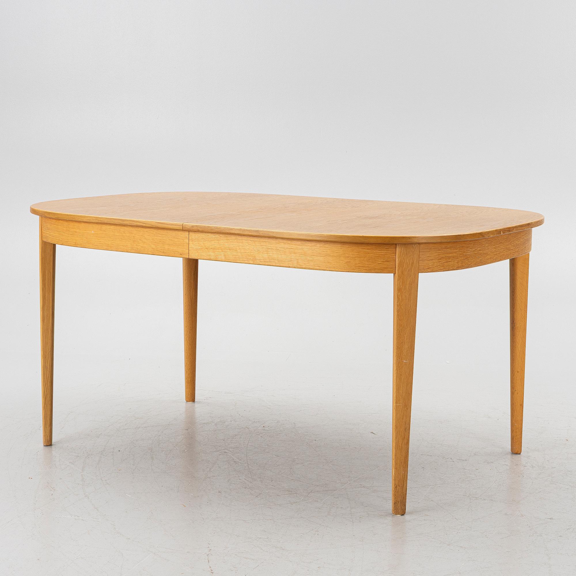 Carl Malmsten, Dining table with 6 chairs, “Ambassadör”, second half of the 20th century.
