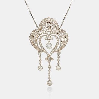 1109. A platinum and 18K gold pendant set with old-, eight- and rose-cut diamonds.