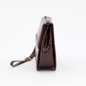 SANDRO VICARI, a brown snakeskin shoulder bag.