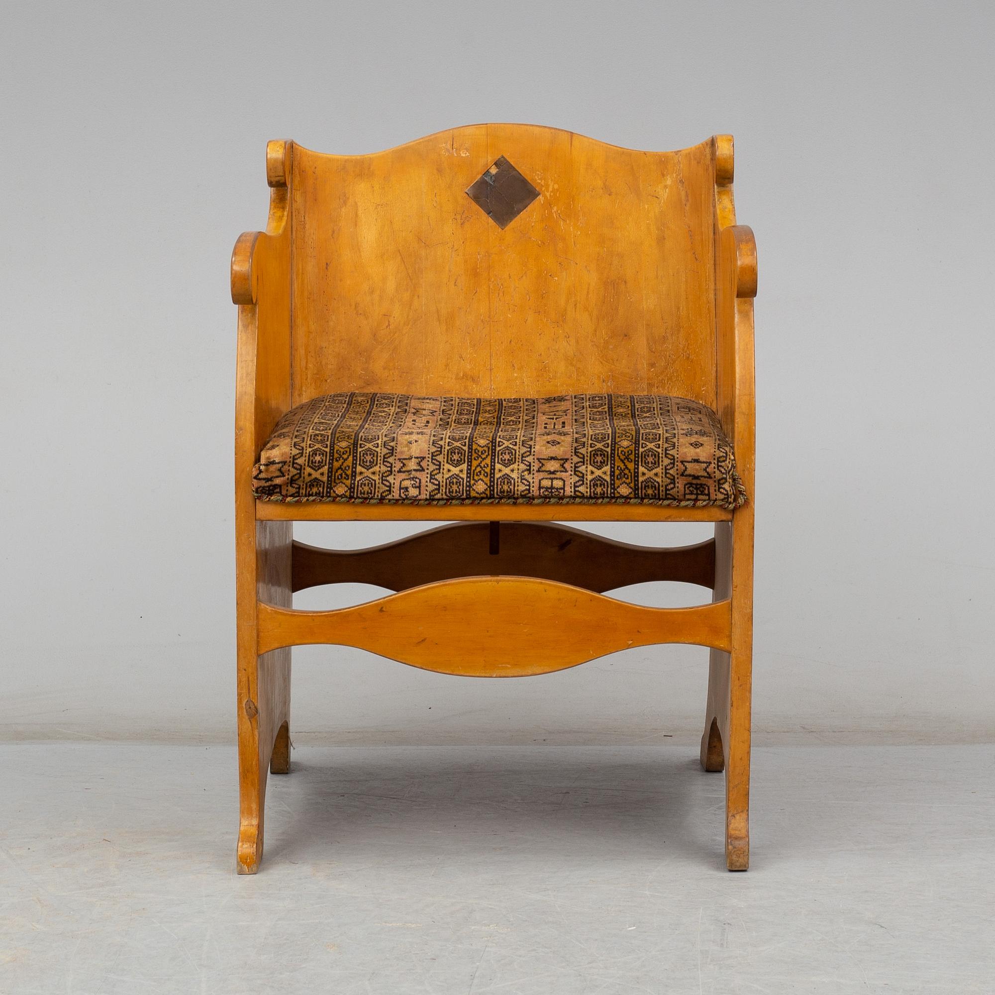 An early 20th century birch armchair.