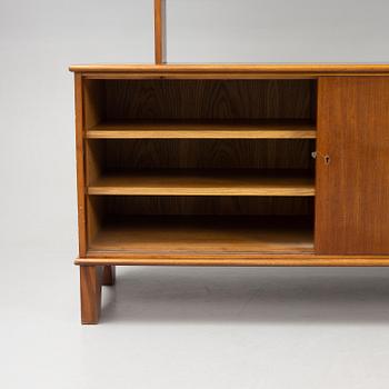 Josef Frank, a mahogny sideboard with cabinets, shelves, writing flap and drawers, Svenskt Tenn, a special commission, 1940-50s.