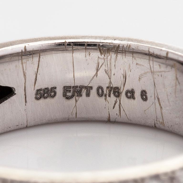 A 14K white gold ring with diamonds.