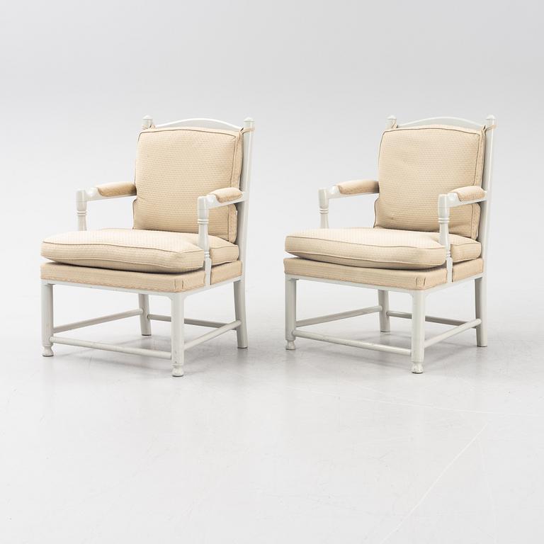 A pair of Gustavian style armrest chairs, 20th century.