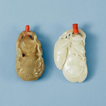 1619. Two Chinese nephrite snuff bottles with stoppers.