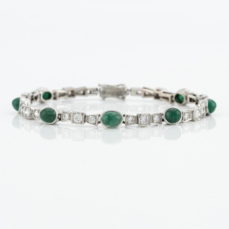 Bracelet, 18K white gold with cabochon-cut emeralds and brilliant-cut diamonds.