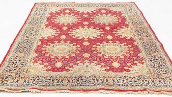 An oriental carpet, c. 290 x 198 cm.