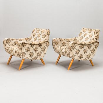 A pair of 1950s / 60s armchairs.