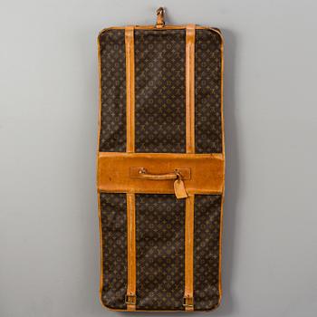 A Louis Vuitton vintage Monogram Canvas Homme Garment Bag.