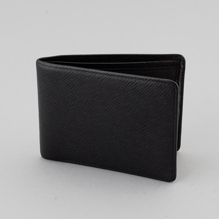 LOUIS VUITTON, black taiga leather wallet.
