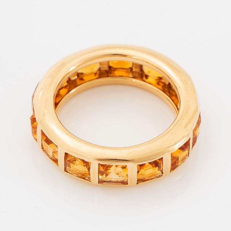 An 18K gold ring set with step-cut citrines.