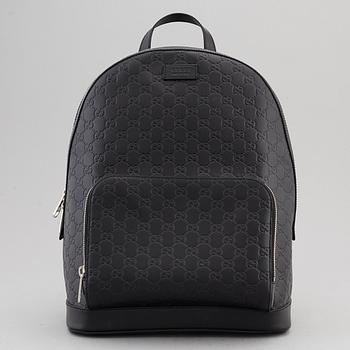 GUCCI a black leather backpack. Bukowskis