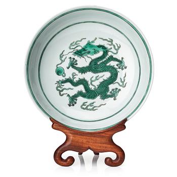 654. A green glazed five clawed dragon dish, Qing dynasty with Qianlong mark.