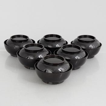 A set of six Japanese lacquer bowls with covers, 20th century.