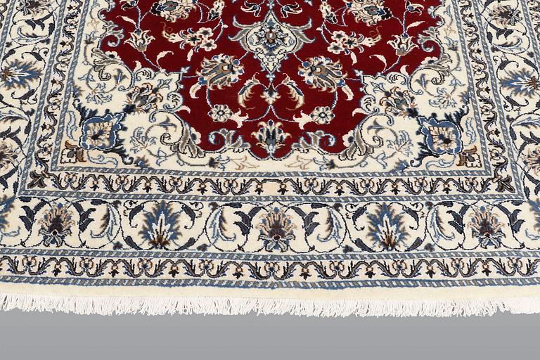 A rug, Nain part silk, ca 208 x 149 cm.