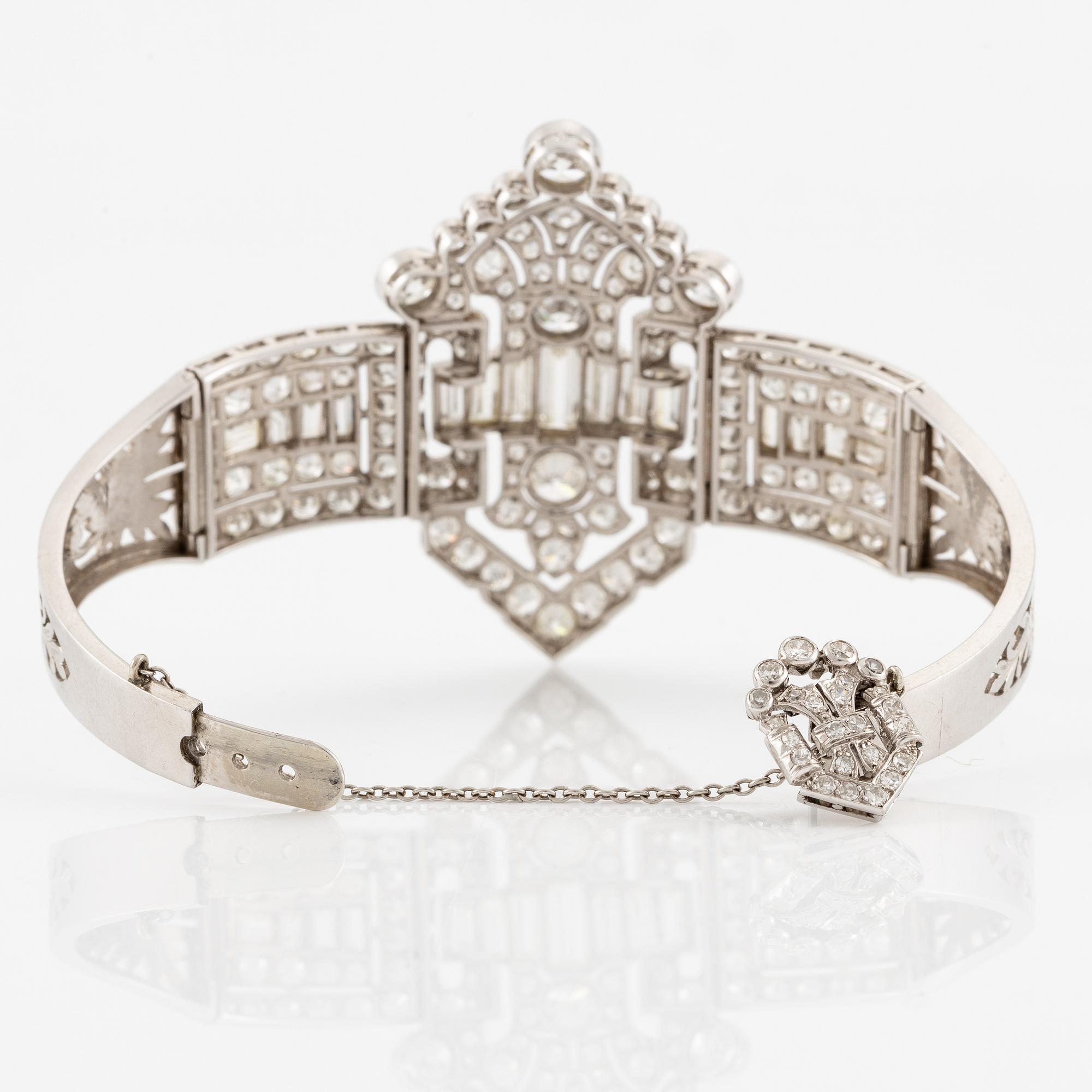 A bracelet in platinum set with baguette and brilliant-cut diamonds, Art Déco.