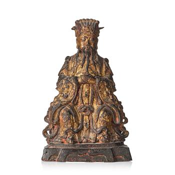 1242. A Chinese gilt lacquered figure of a daoist deity, Ming dynasty (1368-1644).