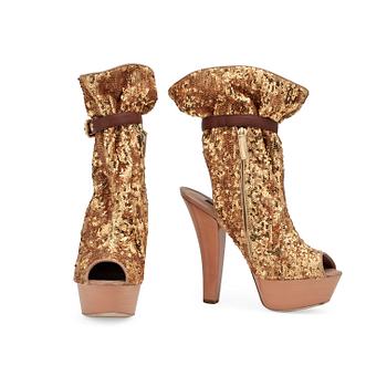 LOUIS VUITTON, a pair of gold spangled boots with peep-toe.