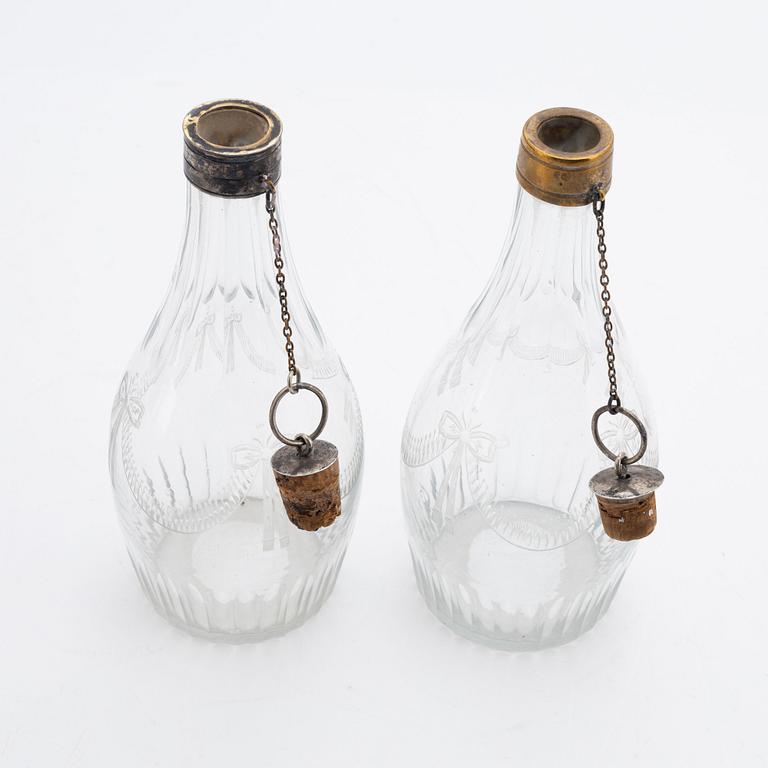 A pair of late gustavian glass and silver vinegar bottles, circa 1800.