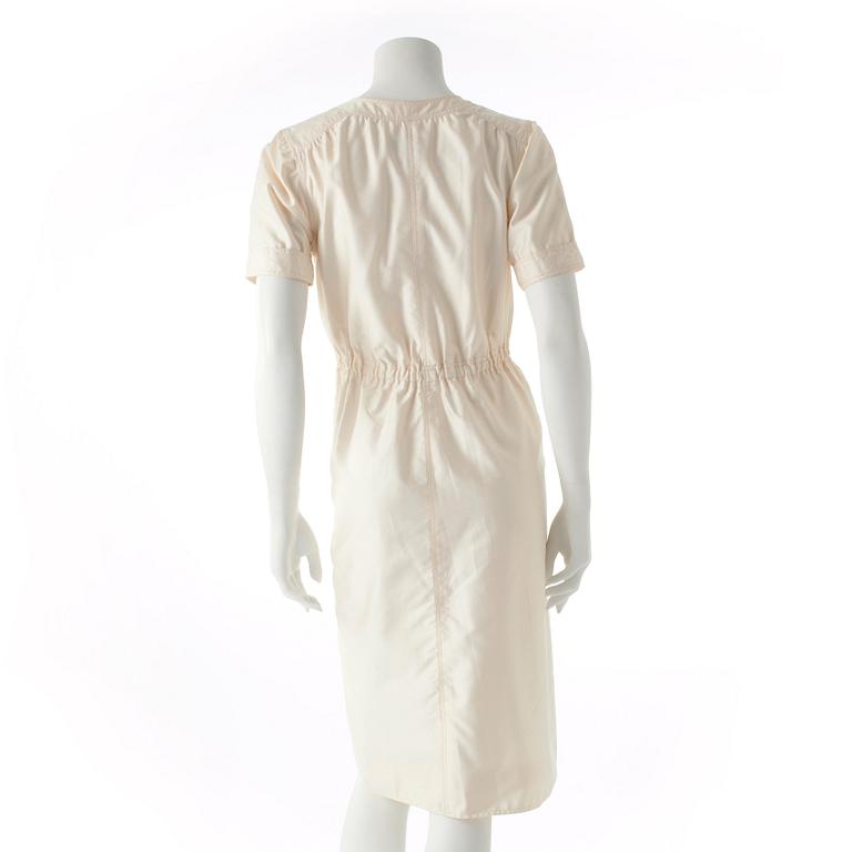 COURRÈGES, a creme colored silk dress.