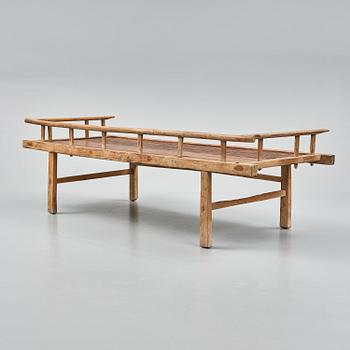 A wooden daybed, South East Asia.