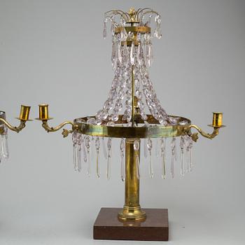 A pair of late Gustavian style three-light candelabra.