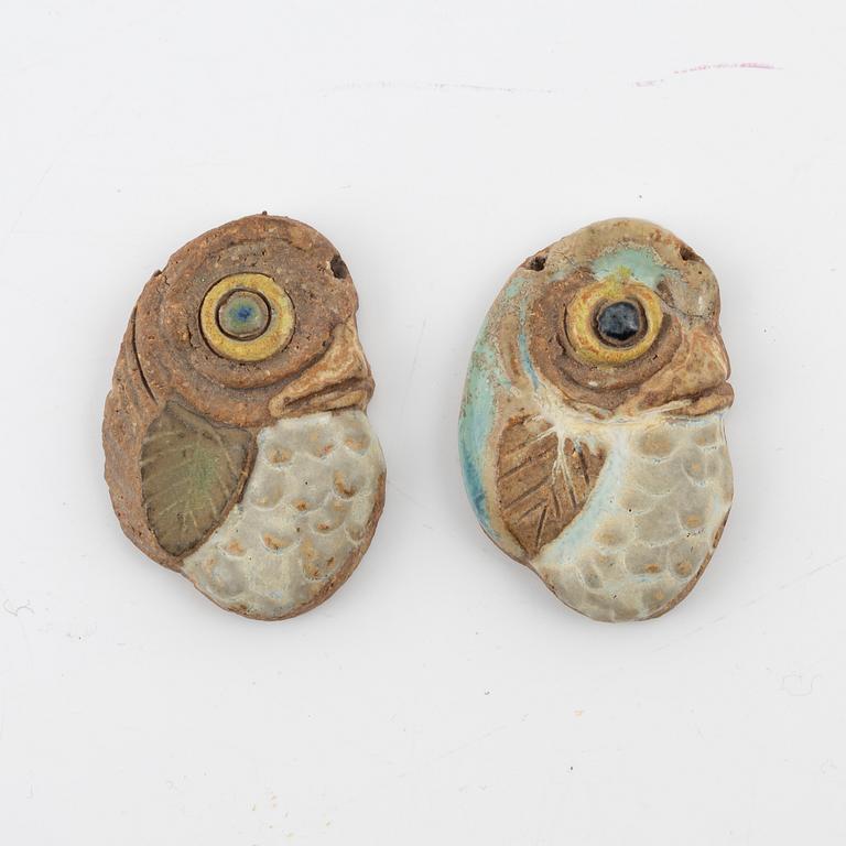 Tyra Lundgren, two stoneware pendants.