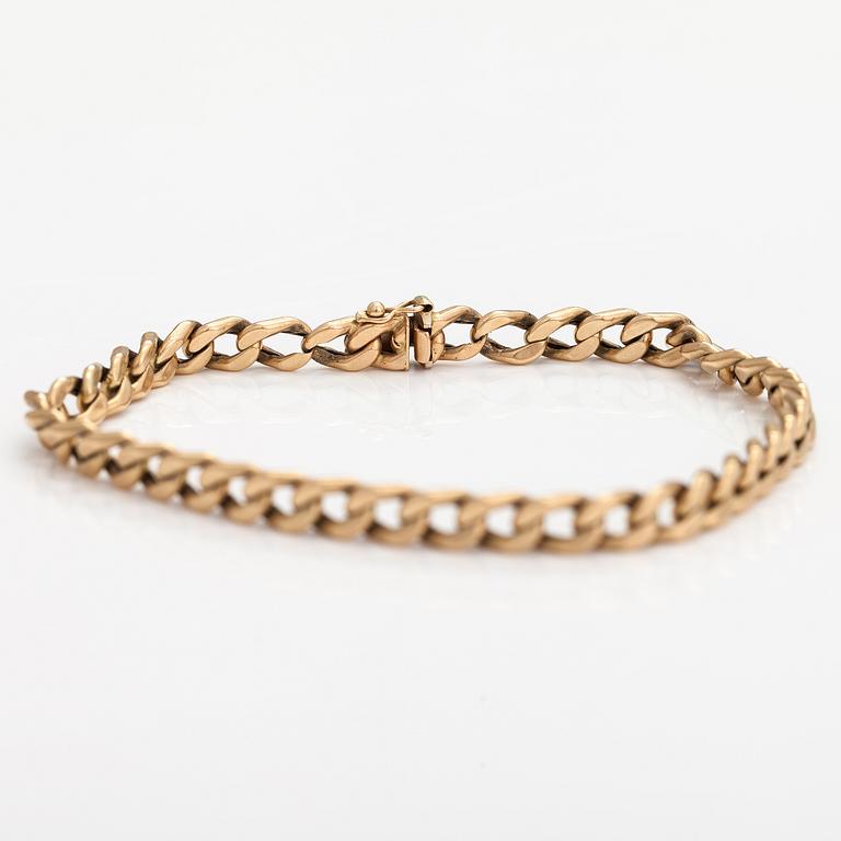 A 14K gold bracelet.