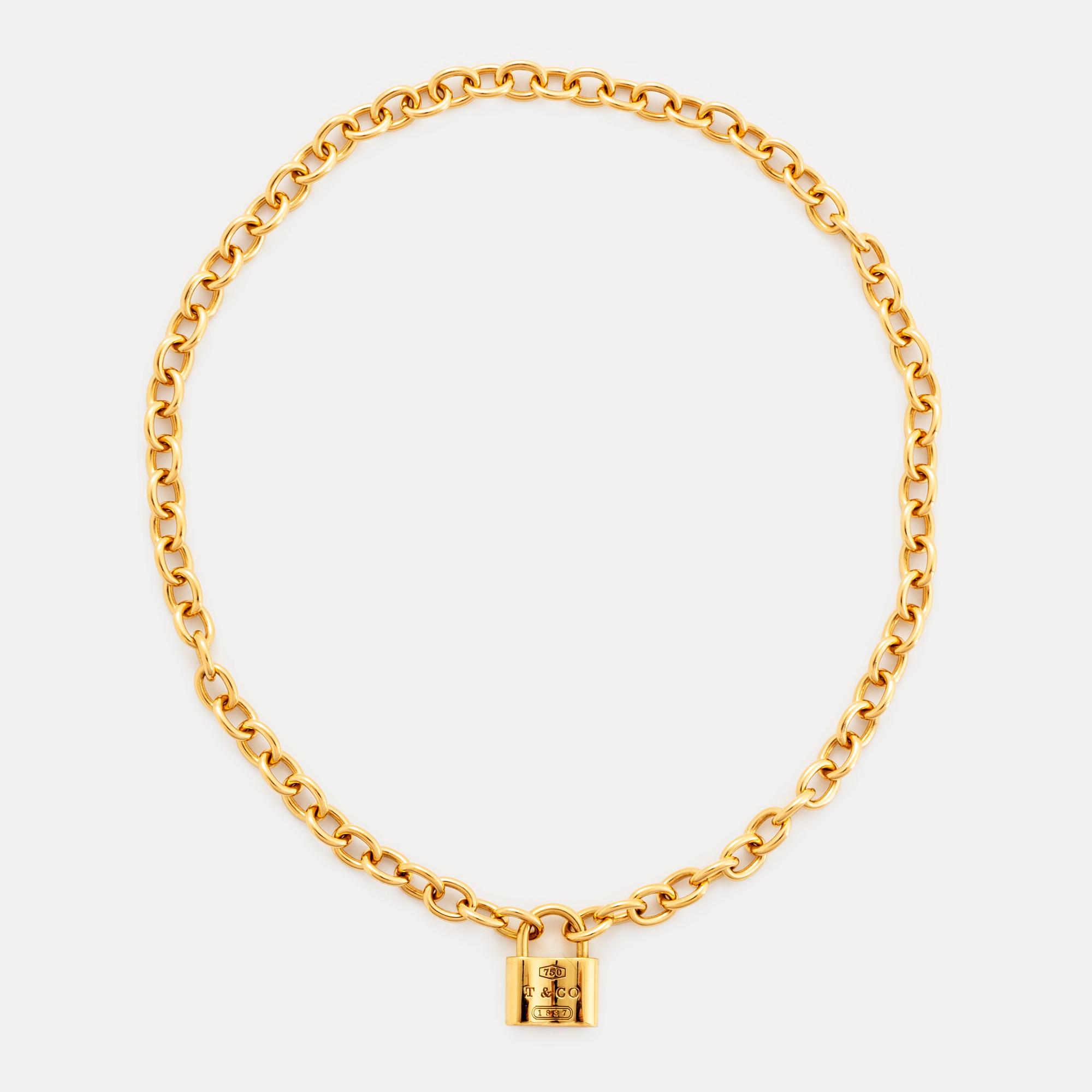 A Tiffany lock charm pendant necklace "1837" in 18K gold.