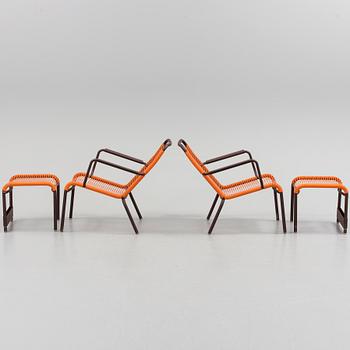 a pair of FRÉDÉRIC SOFIA "Saint Tropez" lounge chairs with footstools, by Fermob.