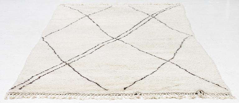 A Moroccan carpet, c. 282 x 150 cm.