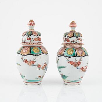 A pair of Japanese jars with covers, circa 1900.