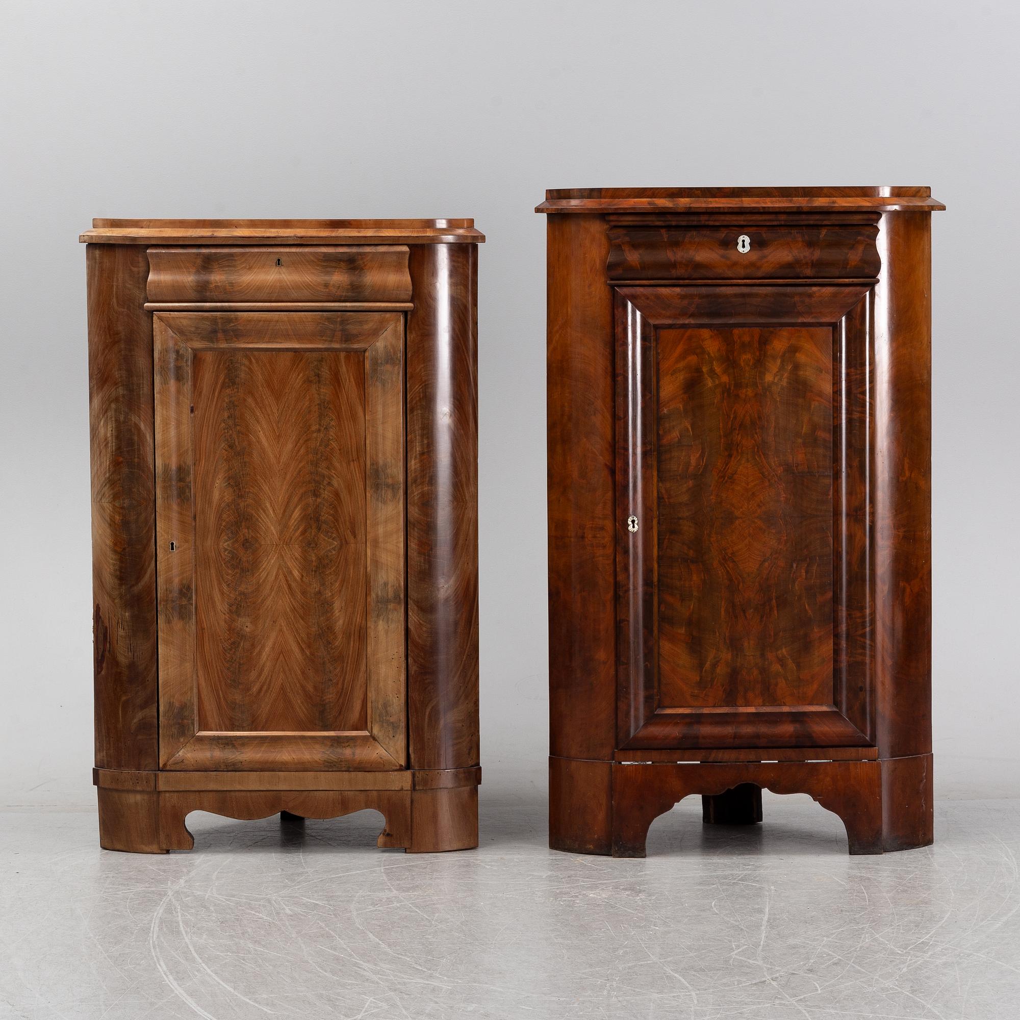 A pair of mahogany corner cabinets, mid 19th Century.